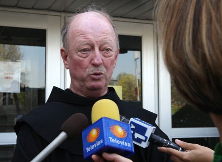 Father Bill Sweetney, principal of St. Francis Preparatory School, addresses the media outside the school in New York City borough of Queens on April 26, 2009. New York Mayor Michael Bloomberg said Sunday that the Centers for Disease Control and Prevention ( CDC) confirmed that eight students of St. Francis Preparatory School have been infected with swine flu. 