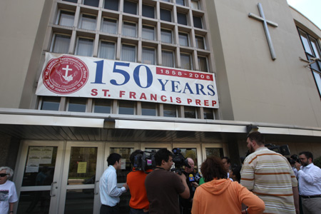 Journalists make coverage outside the St. Francis Preparatory School in New York City borough of Queens on April 26, 2009. New York Mayor Michael Bloomberg said Sunday that the Centers for Disease Control and Prevention ( CDC) confirmed that eight students of St. Francis Preparatory School have been infected with swine flu. 