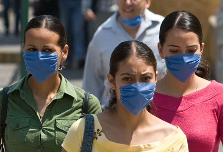 Mexicans wear masks to prevent swine flu in Mexico city, capital of Mexico, on April 26, 2009. Five people have died of swine flu in the last 24 hours in Mexico City, bringing the total of those killed to 15 in the capital, Mexico City&apos;s mayor, Marcelo Ebrard, told media on Sunday. 