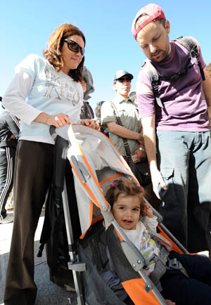 A family from Argentina wait to buy tickets for the Potala Palace in Lhasa, capital of southwest China's Tibet Autonomous Region, on April 26, 2009.