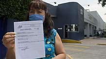 Maria, 45, is another suspect of swine flu virus A (H1N1) after the National Influenza Center in Mexico City, capital of Mexico, examined her on April 26, 2009.