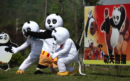 Cartoon panda stars are seen in a scenic spot of Nantong Horticulture Expo Park in Nantong, a city of east China's Jiangsu Province, on April 27, 2009. Bringing many prevailing cartoon stars like panda Paul, Gray Wolf and Happy Sheep to meet visitors, 2009 Nantong Cartoon and Animation Festival was opened in Nantong Horticulture Expo Park on Monday. Activities focusing on eight themes would be held in different scenic spots of the park. 