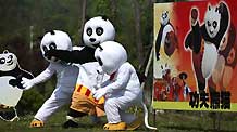 Cartoon panda stars are seen in a scenic spot of Nantong Horticulture Expo Park in Nantong, a city of east China's Jiangsu Province, on April 27, 2009. Bringing many prevailing cartoon stars like panda Paul, Gray Wolf and Happy Sheep to meet visitors, 2009 Nantong Cartoon and Animation Festival was opened in Nantong Horticulture Expo Park on Monday. Activities focusing on eight themes would be held in different scenic spots of the park.