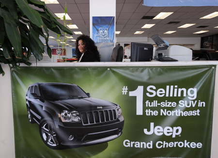 An employee works in a Chrysler dealer in New York, the US, in this file photo taken on April 24, 2009. 