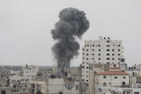 Smokes rise on the border line between the Gaza Strip and Egypt after Israeli jets bombed underground smuggling tunnels in Rafah town, southern Gaza Strip, on May 2, 2009. An Israeli army spokesman confirmed the airstrikes on Rafah tunnels. Three Palestinians were wounded in these strikes. 