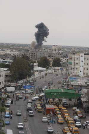 Smokes rise on the border line between the Gaza Strip and Egypt after Israeli jets bombed underground smuggling tunnels in Rafah town, southern Gaza Strip, on May 2, 2009. An Israeli army spokesman confirmed the airstrikes on Rafah tunnels. Three Palestinians were wounded in these strikes.