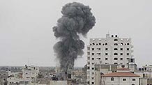 Smokes rise on the border line between the Gaza Strip and Egypt after Israeli jets bombed underground smuggling tunnels in Rafah town, southern Gaza Strip, on May 2, 2009. An Israeli army spokesman confirmed the airstrikes on Rafah tunnels. Three Palestinians were wounded in these strikes.