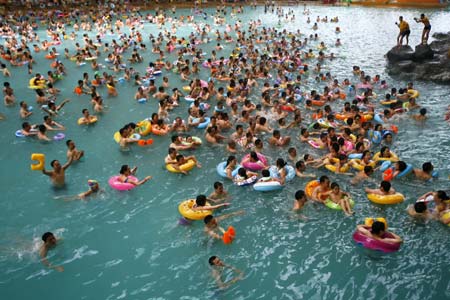 Chinese tourists enjoy leisure time of their holiday at a resort named 