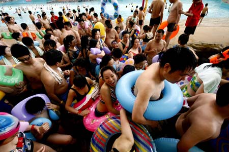 Chinese tourists spend their holiday at a resort named 