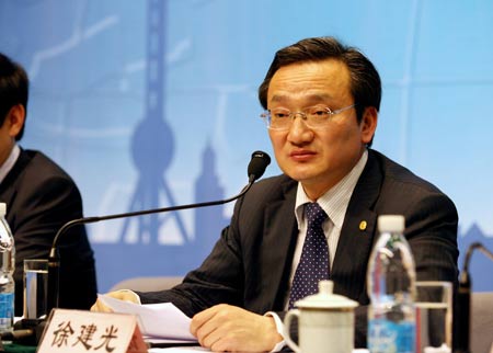 Xu Jianguang, head of Shanghai municipal health bureau, speaks at a press conference in Shanghai, east China, May 3, 2009. Sixty-eight people who were on the same Mexico City-Shanghai flight with a Mexican national later diagnosed with influenza A/H1N1 in Hong Kong, have been located and are in quarantine in Shanghai, health officials told reporters Sunday. None have displayed any flu symptoms, according to Xu Jianguang.