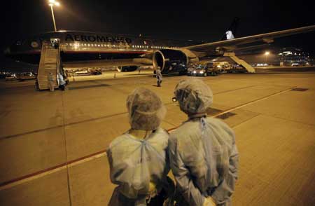 The Mexican charter flight parks at Hong Kong International Airport in Hong Kong, south China, on May 6, 2009. The charter flight, which had picked up quarantined Mexicans from Shanghai, Beijing and Guangzhou, arrived in Hong Kong early Wednesday morning to pick up another 12 Mexican tourists, and then left China for Mexico.