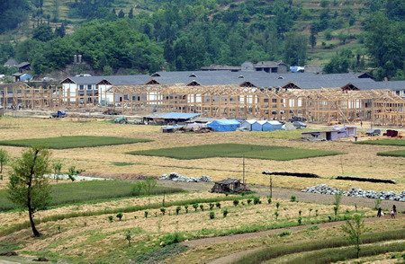 New houses are under construction in Qingchuan County, southwest China's Sichuan Province, on May 6, 2009.