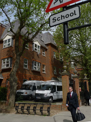 A man walks past the gate of the South Hampstead High School in London, on May 6, 2009. Five British schools hit by A/H1N1 flu have been temporarily closed up, announced the government's Health Protection Agency on May 5. 