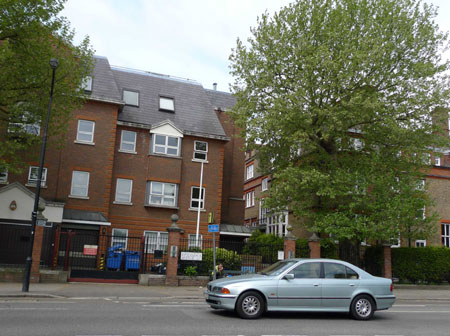 A car passes by the gate of the South Hampstead High School in London, on May 6, 2009. Five British schools hit by A/H1N1 flu have been temporarily closed up, announced the government's Health Protection Agency on May 5.