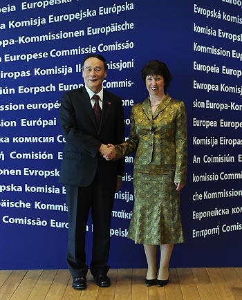 Chinese Vice Premier Wang Qishan (L) shakes hands with European Union Commissioner for Trade Catherine Ashton prior to the Second China-EU High Level Economic and Trade Dialog at the EU headquarters in Brussels, capital of Belgium, on May 7, 2009. 