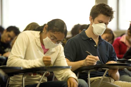 Students wearing masks attend their class at the National Autonomous University of Mexico (NAUM) in the Mexico City on May 7, 2009.