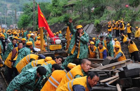 A large number of constructors converge on the renewal of railroad switch for expedition at the Hengxianhe Station, during an intensive renovation of the Baoji-Chengdu Railway, at Lueyang, northwest China's Shaanxi Province, on May 9, 2009. 