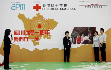 The opening ceremony of a photo exhibition on the May 12, 2008 earthquake is held in Hong Kong, south China, on May 11, 2009. 