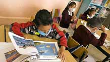 Pupils attend a class at a primary school in Mexico City, capital of Mexico, on May 11, 2009. Most of Mexican pre-school educational institutions as well as primary and secondary schools resume classes May 11 after days of closure due to the influenza epidemic.