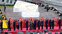 Foreign diplomats present flowers during the commemorative service to mark the first anniversary of May 12 Earthquake in Yingxiu Township of Wenchuan County, southwest China's Sichuan Province, on May 12, 2009.