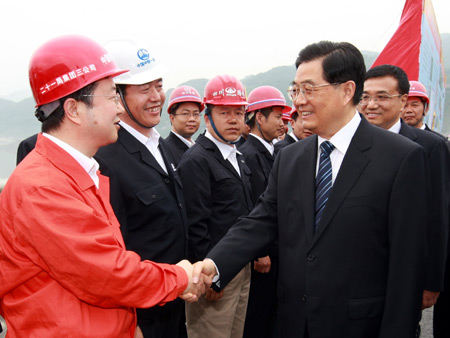 Chinese President Hu Jintao and vice Premier Li Keqiang meet with construction workers of the highway project from Dujiangyan to Yingxiu in southwest China's Sichuan Province. Hu Jintao and Li Keqiang visited the reconstruction projects in the quake-hit places in southwest China's Sichuan Province on May 11 and May 12, 2009. 