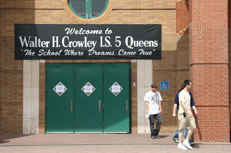 Three men walk out from the IS 5 school in Elmhurst of Queens borough of New York, the US, on May 15, 2009. Three New York City public schools in its Queens borough, IS 238 in Jamaica, PS 16 in Corona and IS 5 in Elmhurst, were closed on Friday due to reports of many children with flu-like symptoms.