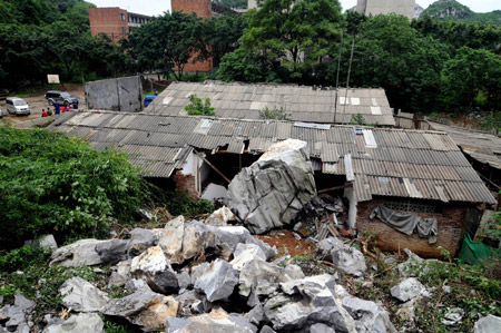 The picture taken on May 20, 2009 shows a local residece which was destroyed by rolling stones after a heavy rain hit Liuzhou City, southwest China&apos;s Guangxi Zhuang Autonomous Region. Two people were injured in the incident. Heavy rain swept across provinces in south China for the second day and agricultural crops in some rural areas were flood by the unexpected summer flood. 