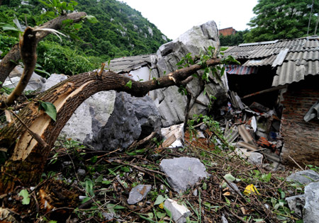 The picture taken on May 20, 2009 shows a local residece which was destroyed by rolling stones after a heavy rain hit Liuzhou City, southwest China&apos;s Guangxi Zhuang Autonomous Region.