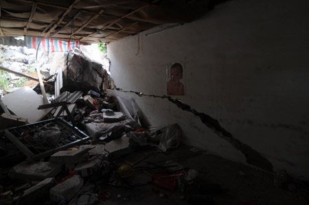 The picture taken on May 20, 2009 shows a local residece which was destroyed by rolling stones after a heavy rain hit Liuzhou City, southwest China&apos;s Guangxi Zhuang Autonomous Region.