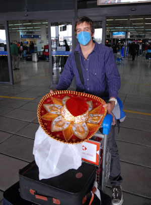 A passenger who took MEXICANA to Argentina walks out of an international airport in Buenos Aires, capital of Argentina, on May 20, 2009. An airplane of MEXICANA arrived in Buenos Aires on Wednesday, marking an official resumption of the straight flight between Argentina and Mexico due to the A/H1N1 flu influence for weeks.