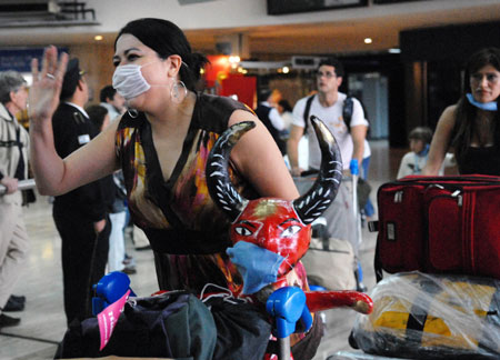 A passenger who took MEXICANA to Argentina walks out of an international airport in Buenos Aires, capital of Argentina, on May 20, 2009. An airplane of MEXICANA arrived in Buenos Aires on Wednesday, marking an official resumption of the straight flight between Argentina and Mexico due to the A/H1N1 flu influence for weeks.