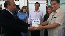 World Health Organization (WHO) and Pan American Health Organization (PHO) representative Angel Valencia (1st L) receives a box of samples of the A/H1N1 virus after it was collected in Panama City, capital of Panama, on May 20, 2009.