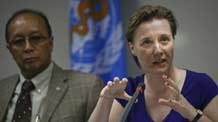 Dr. Julie Hall (R), an expert on Emerging Infectious Diseases, explains various ways of contracting the A/H1N1 Influenza virus now spreading among humans in the World Health Organization (WHO) Western Pacific Office in Manila, capital of the Philippines, on May 22, 2009. The spread of the influenza A/H1N1 virus may pick up in the Asia Pacific region with the onset of southern winter and the threat joined by the spread of seasonal influenza might take a heavy toll on countries' health system, the regional World Health Organization (WHO) expert warned Friday.