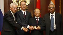 Chinese State Councilor Dai Bingguo (2nd R) poses for a group photo with Indian National Security Advisor R. K. Narayanan (1st R), minister of Strategic Affairs of Brazil Roberto Mangabeira Unger (1st L) and Russian Security Council Secretary Nikolai Patrushev after their meeting in Moscow, Russia, on May 29, 2009.