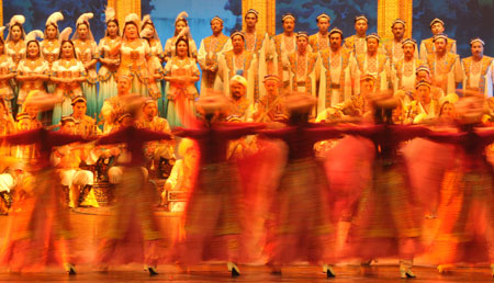 Actors perform the Uyghur Muqam in Urumqi, capital of northwest China&apos;s Xinjiang Uygur Autonomous Region, on May 27, 2009. Xinjiang Uyghur Muqam is a mixture of song, dance, folk performing art and classical music.