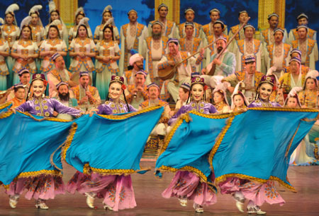 Actors perform the Uyghur Muqam in Urumqi, capital of northwest China&apos;s Xinjiang Uygur Autonomous Region, on May 27, 2009. Xinjiang Uyghur Muqam is a mixture of song, dance, folk performing art and classical music.