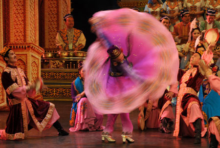 Actors perform the Uyghur Muqam in Urumqi, capital of northwest China&apos;s Xinjiang Uygur Autonomous Region, on May 27, 2009. Xinjiang Uyghur Muqam is a mixture of song, dance, folk performing art and classical music. 