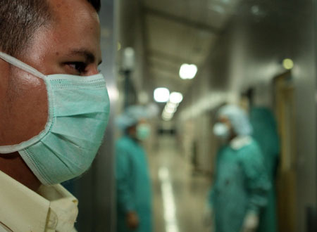 Several medical workers rest in the special wards area receiving a A/H1N1 flu case at a children's hospital in Managua, capital of Nicaragua, on June 1, 2009. A five-year-old girl was confirmed to be the first A/H1N1 flu case in the country on June 1. 