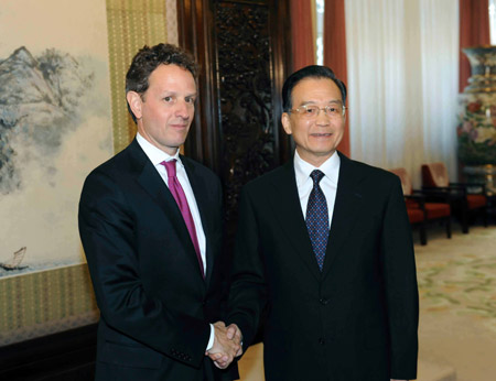 Chinese Premier Wen Jiabao (R) meets with visiting US Treasury Secretary Timothy Geithner in Beijing, capital of China, on June 2, 2009. 