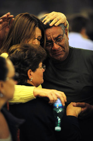 Relatives of the victims of the missing Air France's airliner comfort each other after a pray at the Candelaria Church in Rio de Janeiro, Brazil, on June 4, 2009. A pray was held here on Thursday for the victims of the missing airliner.