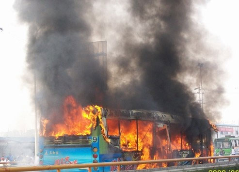 This picture shows a big fire is engulfing a bus on the street of Chengdu, capital of southwest China's Sichuan Province on Friday, on June 5, 2009.