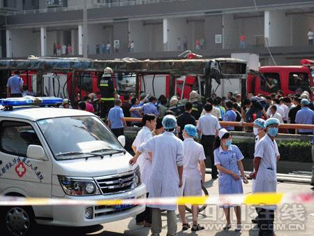 Fire engines and ambulances rush to the scene where huge plumes of black smoke billowed up from a bus on Friday, on June 5, 2009.