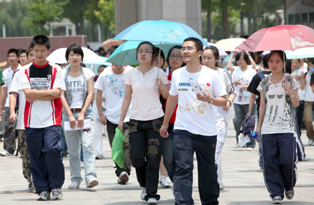 Chinese students and their family members walk home after they finished the first day tests of the National College Entrance Examination, which will last until Tuesday for three days across China, in Rui'an city in east China's Zhejiang province, on June 7, 2009. Some 10.2 million Chinese school students are to compete this year in the world's largest annual examination for a quota of 6.29 million to learn in universities and colleges. 