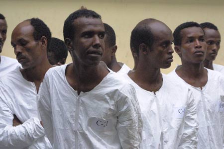 Some suspected Somali pirates are seen in Mombasa, city of east Kenya, June 10, 2009. US Navy handed over 17 suspected Somali pirates to Kenyan authorities on Wednesday against the backdrop of foreign warships stepping up naval patrols off the coast of Somalia. Some suspected Somali pirates are seen in Mombasa, city of east Kenya, June 10, 2009. US Navy handed over 17 suspected Somali pirates to Kenyan authorities on Wednesday against the backdrop of foreign warships stepping up naval patrols off the coast of Somalia.