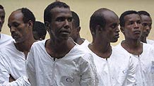 Some suspected Somali pirates are seen in Mombasa, city of east Kenya, June 10, 2009. US Navy handed over 17 suspected Somali pirates to Kenyan authorities on Wednesday against the backdrop of foreign warships stepping up naval patrols off the coast of Somalia.