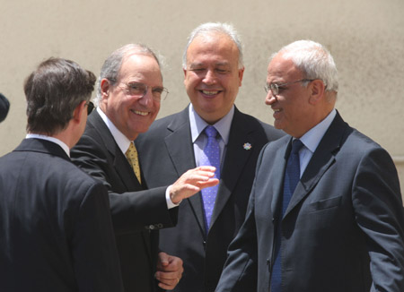 US peace envoy George Mitchell (2nd L) smiles upon his arrival in the West Bank city of Ramallah, on June 10, 2009. 