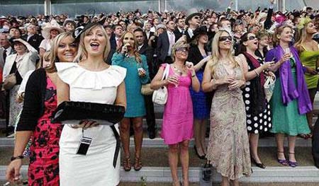 Racegoers cheer on their horses during the third day of Royal