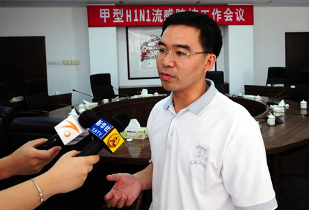 Wang Yongquan, deputy head of the Shipai township team to control A/H1N1 flu, speaks to the media at the Shipai County government office in Dongguan, south China's Guangdong Province, where six new cases of A/H1N1 flu at the Shipaizhen central primary school of Shipai county had been confirmed on Friday June 19, 2009.