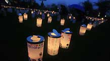 Plastic cups with candles in are set during the Candle Night campaign to call for saving the electricity with the lights off in Roppongi in Tokyo, capital of Japan, on June 21, 2009.