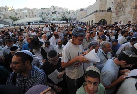 Demonstrators gather for a rally to denounce Israeli government's policy on Jewish settlements, at the Western Wall in Jerusalem's Old City on June 21, 2009. Israeli Prime Minister Benjamin Netanyahu vowed in a keynote speeck on June 14 that Israel would not build any new settlements and would refrain from expanding existing Israeli communities in the West Bank.